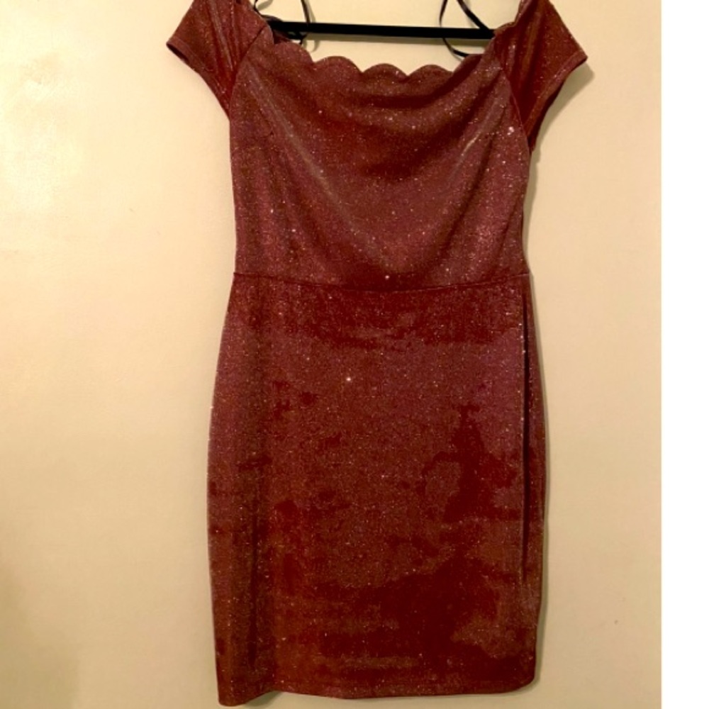 Wine color red dress with glitter all over.Gives you a shine each time you walk.